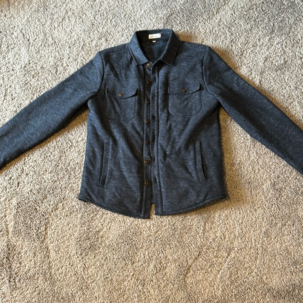 Peter Millar quilted jacket.  Size medium.  Navy color.  Perfect condition.